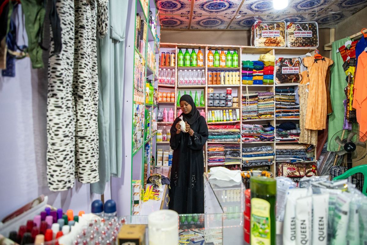 A graduate in her shop