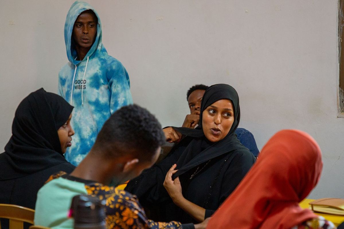 Young people talking during a training break